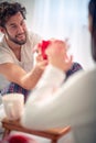 Men in the bed with his lovely girl, giving Christmas gift Royalty Free Stock Photo