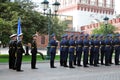 Men in black and blue military uniform.