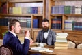 Men with busy faces drink tea. Men in suits, professors Royalty Free Stock Photo