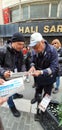 Men buying lotto ticket along the streets of Istanbul