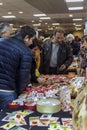 Men buying martisoare to celebrate beginning of spring on March