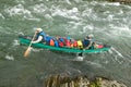 Men in canoe on wild, remote Alaskan river rapids