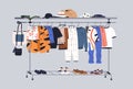 Men capsule wardrobe with summer casual clothes on hangers, racks and shelves. Male fashion garments, footwear and Royalty Free Stock Photo