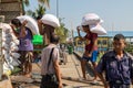 Men carry huge sacks of rice on their backs, Yangon