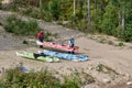 Men carry kayaks to the water, preparing for the competition Royalty Free Stock Photo