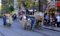 Men carrying merchandise in the middle of the street of Istanbul