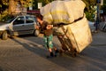 Men carrying merchandise in the middle of the street of Istanbul