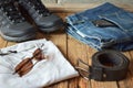 Men casual outfits. Men shoes, clothing and accessories on wooden background - grey t-shirt, blue jeans, sneakers with eyeglass Royalty Free Stock Photo