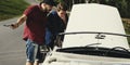 Men Checking Broke Down Car on Street Side with Open Hood