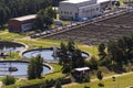 Men checking water tanks at sewage treatment plant