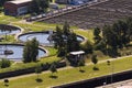 Men checking water tanks at sewage treatment plant