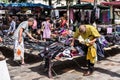 Men choose clothes at the flea Aligre Market. Paris, France