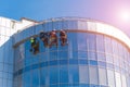 Men cleaning glass building. high-rise, industrial alpinism Royalty Free Stock Photo