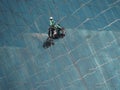 Men cleaning glass building