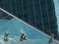 Men cleaning glass building Royalty Free Stock Photo