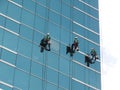 Men cleaning glass building Royalty Free Stock Photo