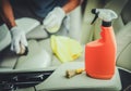 Men Cleaning Vehicle Interior Using Sanitizing Detergent