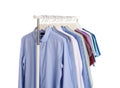 Men clothes hanging on wardrobe rack Royalty Free Stock Photo