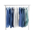 Men clothes hanging on wardrobe rack