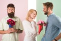 Men competitors with bouquets flowers try conquer girl. Broken heart concept. Girl smiling made her choice. Girl popular Royalty Free Stock Photo