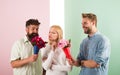 Men competitors with bouquets flowers try conquer girl. Girl likes to be in middle attention. Girl popular receive lot Royalty Free Stock Photo