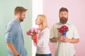 Men competitors with bouquets flowers try conquer girl. Girl smiling made her choice. Girl popular receive lot male Royalty Free Stock Photo