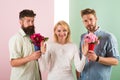 Men competitors with bouquets flowers try conquer girl. Girl smiling reject gifts. Out of relations. Girl popular Royalty Free Stock Photo