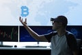 Men controls Bitcoin in virtual reality world Royalty Free Stock Photo
