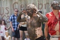 Men covered in mud perform on stage at the Bristol Renaissance Faire Royalty Free Stock Photo