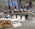 Men cutting timber by primitive method in western Nepal