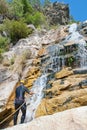 Men descending waterfall Royalty Free Stock Photo