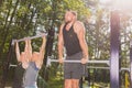 Men doing pull-ups Royalty Free Stock Photo