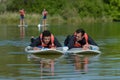 Men doing stand-up paddle Royalty Free Stock Photo