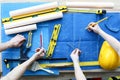 Men draftsmen on table draw construction project