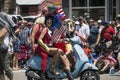 Men in drag on motor scooter celebrate July 4, Independence Day Parade, Telluride, Colorado, USA