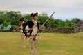 Men dressed as soldiers,reenacting musket use,Fort Ticonderoga,New York,2014