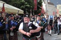 Men dressed in kilts playing Scottish pipes