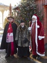 Men dressed in old-fashioned catholic cardinal, priest and Saint Nicholas costumes