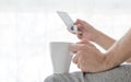 Men drink coffee and chack job on smart phone