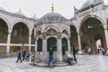 men drinking holy water from taps near suleymaniye mosque