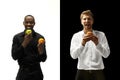 Men eating a hamburger and fruits on a black and white background Royalty Free Stock Photo