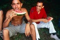 Men eating watermelon, Kosovo.