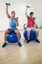 Men exercising on exercise ball Royalty Free Stock Photo