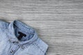 Men Fashion, Blue jeans shirt on a brown wooden background. Royalty Free Stock Photo