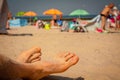 Men feet on the beach. Royalty Free Stock Photo