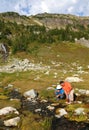 Men Filtering Water from Mountain Stream 2 Royalty Free Stock Photo