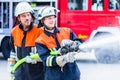 Men of the fire department extinguish fire Royalty Free Stock Photo