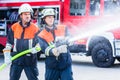 Men of the fire department extinguish fire Royalty Free Stock Photo