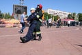 Men firefighter in fireproof suit and helmet rescues drags pulls maniken competitions, Minsk, Belarus, 06.06.2018