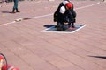 Men firefighter in fireproof suit and helmet saves drags pulls worker man out of danger Royalty Free Stock Photo